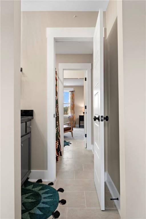 hallway featuring baseboards