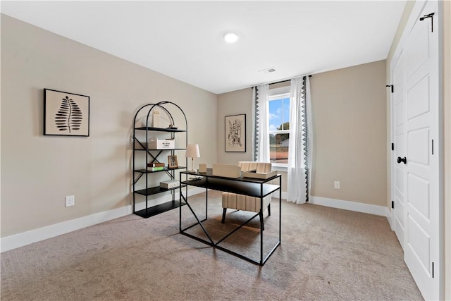 office space with visible vents, baseboards, and carpet flooring