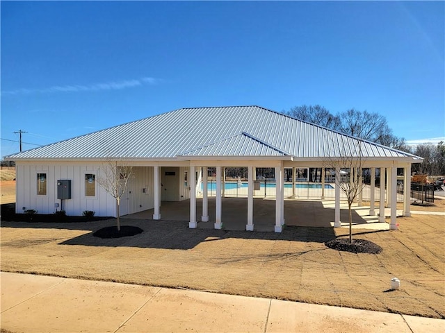 surrounding community with a pool and a patio