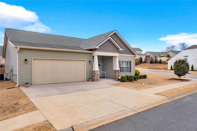 craftsman-style home with concrete driveway, a garage, and roof with shingles