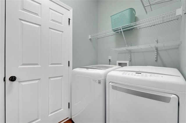 washroom featuring independent washer and dryer and laundry area