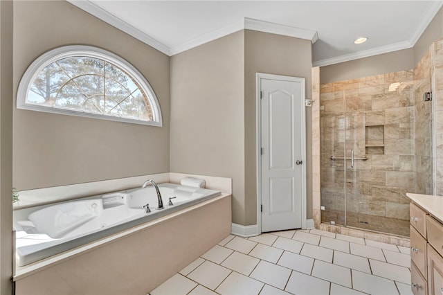 bathroom featuring tile patterned flooring, crown molding, baseboards, a garden tub, and a stall shower