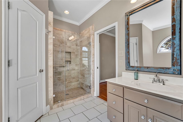 bathroom with vanity, tile patterned floors, a stall shower, and ornamental molding