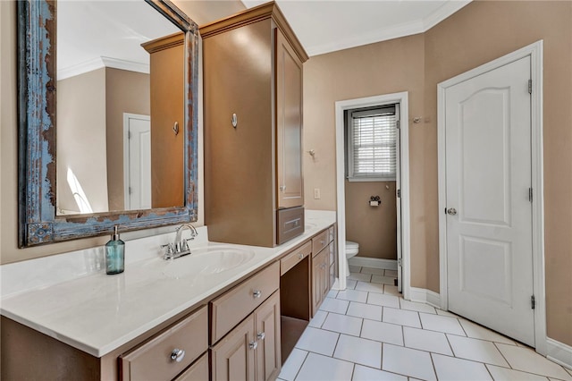 bathroom featuring tile patterned floors, toilet, crown molding, baseboards, and vanity