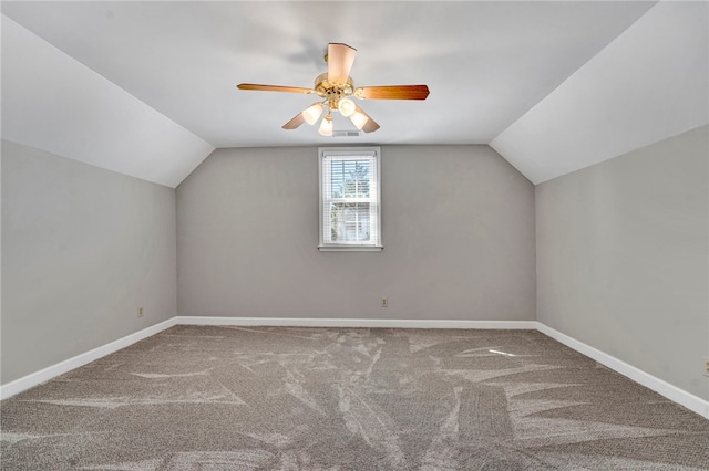 bonus room featuring lofted ceiling, carpet flooring, visible vents, and baseboards