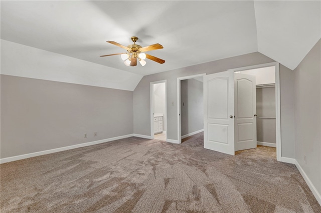 bonus room with baseboards, light carpet, ceiling fan, and vaulted ceiling