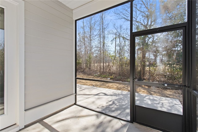 unfurnished sunroom with plenty of natural light