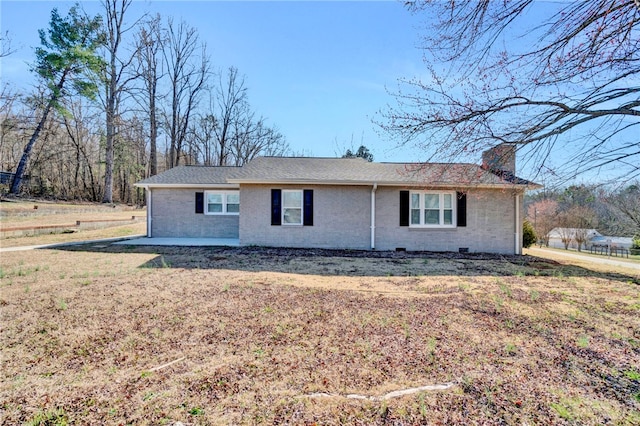 single story home with brick siding, a chimney, and a front lawn