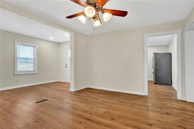 unfurnished room with visible vents, ceiling fan, baseboards, recessed lighting, and wood finished floors