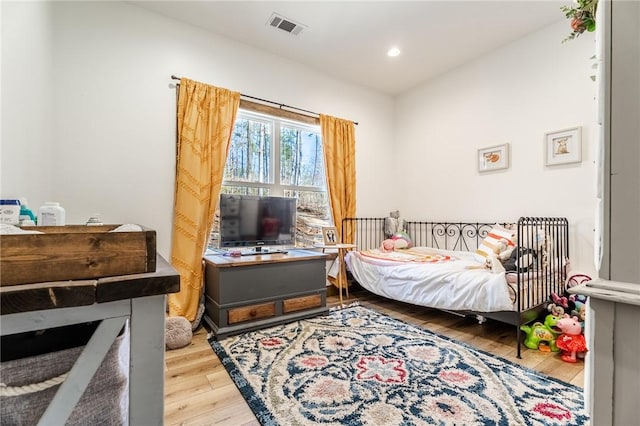 bedroom featuring visible vents, recessed lighting, and wood-type flooring