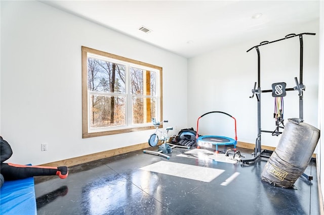 workout area with visible vents and baseboards