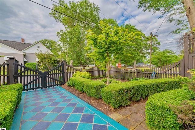 view of gate with fence