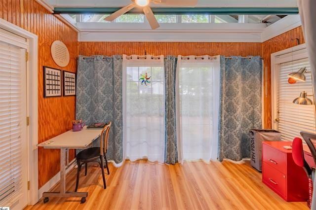 interior space featuring ceiling fan and wood finished floors