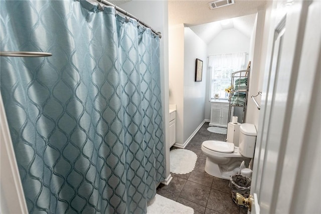 full bath featuring tile patterned floors, visible vents, toilet, vanity, and vaulted ceiling