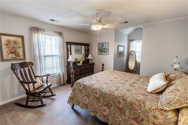 carpeted bedroom with visible vents, baseboards, a textured ceiling, and ceiling fan