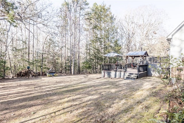 view of yard featuring a wooden deck