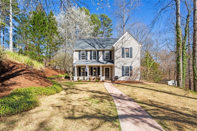 view of front of home featuring a front lawn and covered porch