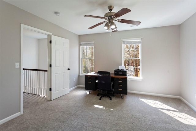 home office with carpet, baseboards, and ceiling fan