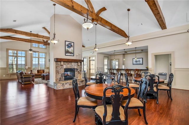 160 Julie Way, Pickens, SC 29671 - dining space featuring a fireplace, a ceiling fan, wainscoting, healthy amount of natural light, and wood finished floors