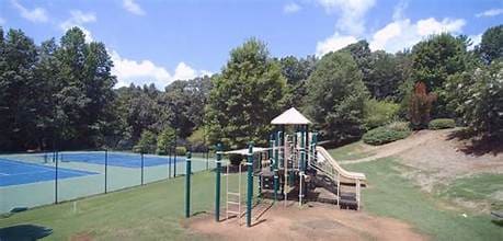 communal playground featuring a yard