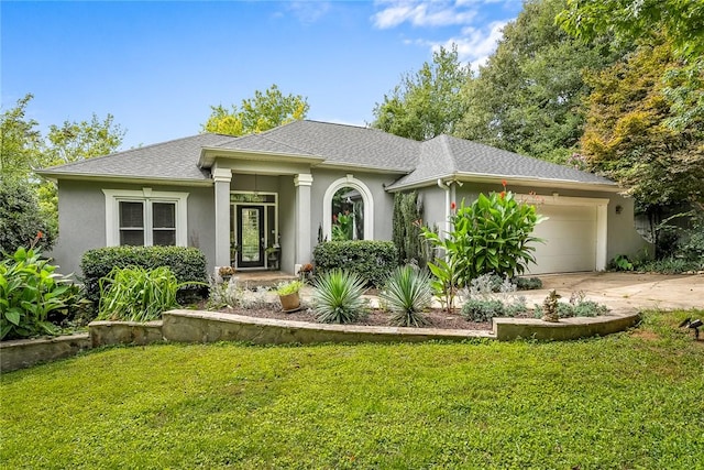 view of front of house featuring stucco siding, driveway, a front yard, a shingled roof, and a garage