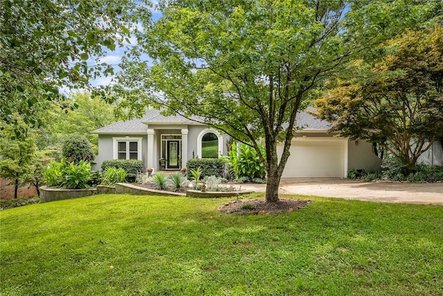 view of front of property with stucco siding, a front lawn, roof with shingles, concrete driveway, and an attached garage