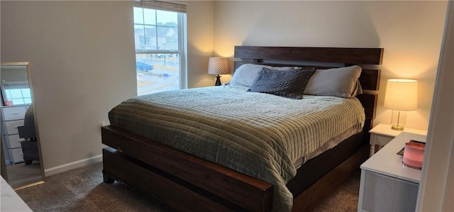 bedroom with carpet and baseboards