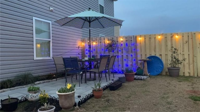 exterior space featuring a patio and fence