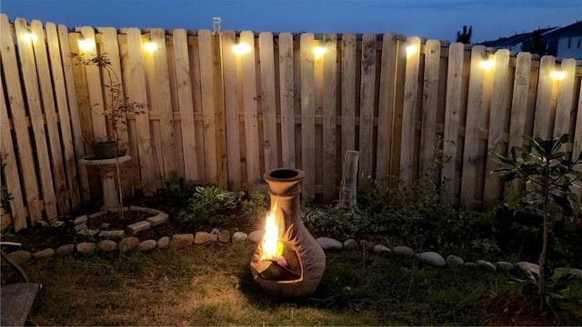 yard at night with fence