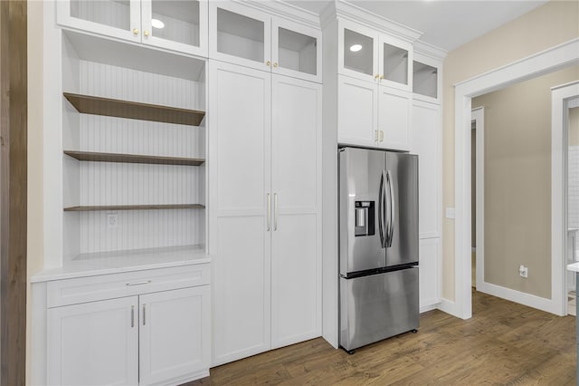 kitchen featuring dark wood-style flooring, white cabinets, stainless steel refrigerator with ice dispenser, and open shelves