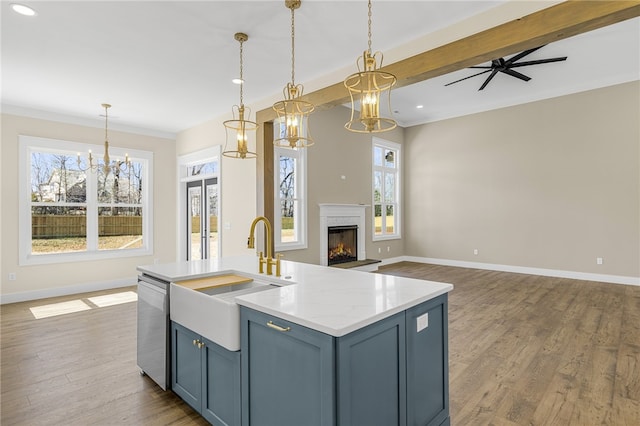 kitchen with dishwasher, a kitchen island with sink, dark wood-style floors, and open floor plan