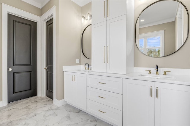 full bath featuring a sink, baseboards, marble finish floor, and double vanity