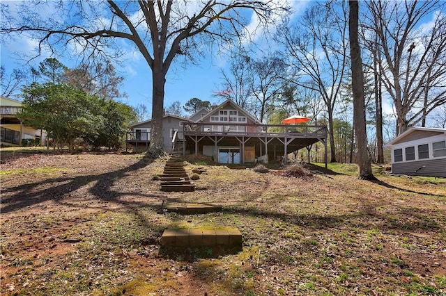 back of house with stairway and a deck