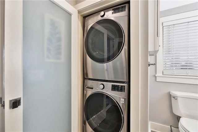 laundry area featuring laundry area and stacked washing maching and dryer