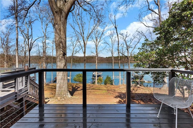 wooden deck with a water view