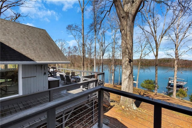 wooden deck with a water view