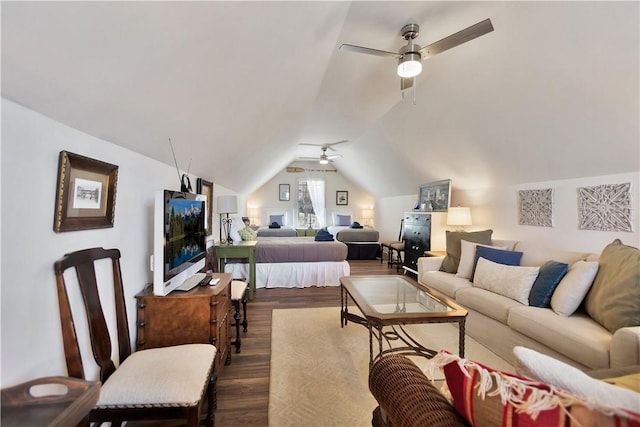 bedroom featuring dark wood finished floors, a ceiling fan, and vaulted ceiling