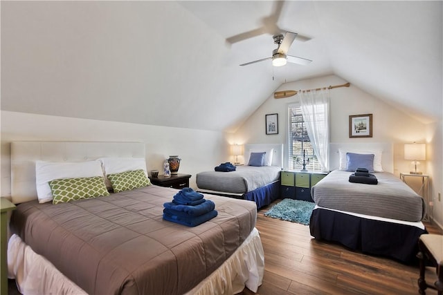 bedroom featuring a ceiling fan, lofted ceiling, and wood finished floors