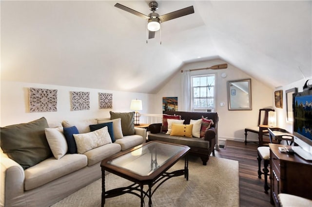 living room featuring vaulted ceiling, a ceiling fan, and dark wood-style flooring