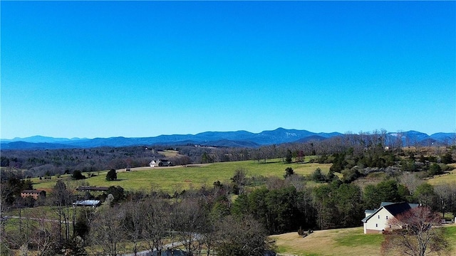 view of mountain feature with a rural view