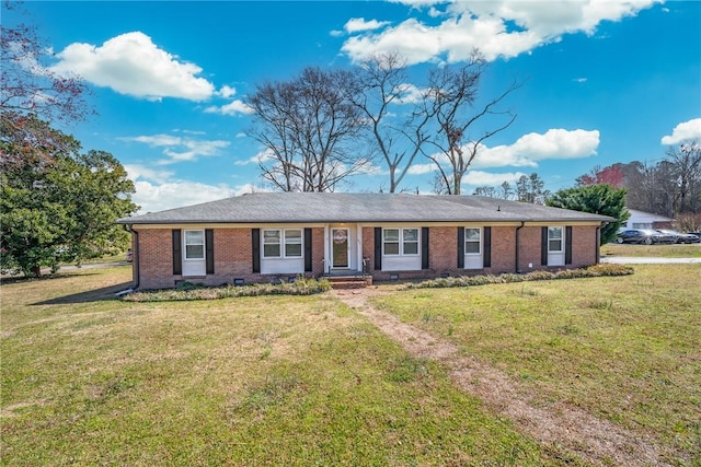 ranch-style house with brick siding and a front yard