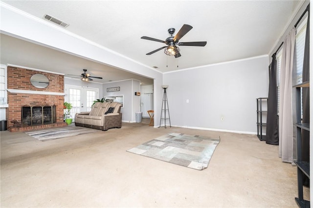 unfurnished living room with crown molding, a brick fireplace, a ceiling fan, and visible vents