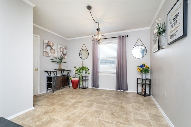 entryway with baseboards, a chandelier, and ornamental molding