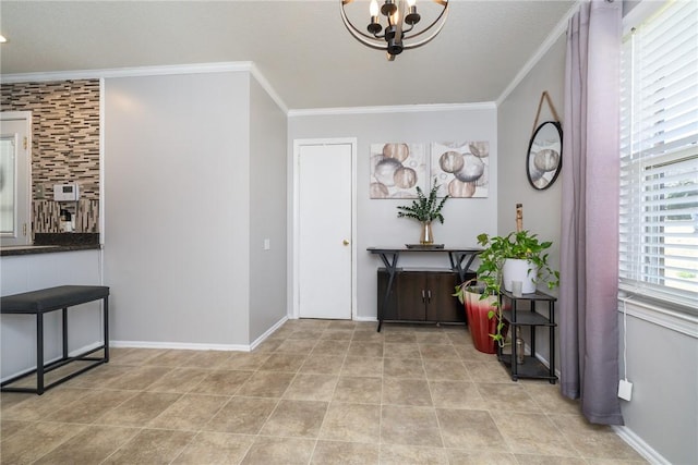 foyer entrance with crown molding, a notable chandelier, baseboards, and light tile patterned floors