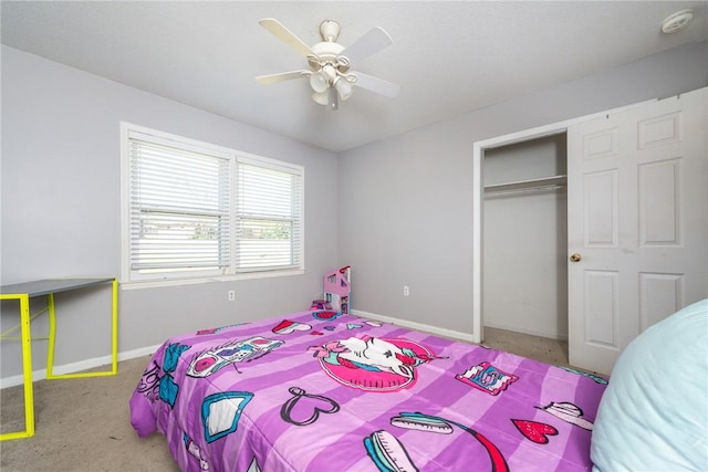 bedroom with baseboards, a closet, and ceiling fan