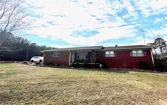 ranch-style home featuring a front lawn, brick siding, and crawl space