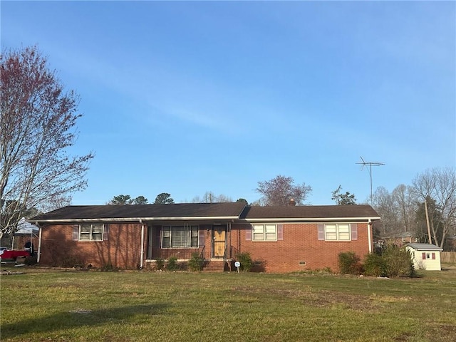 ranch-style house with a front yard, brick siding, and crawl space