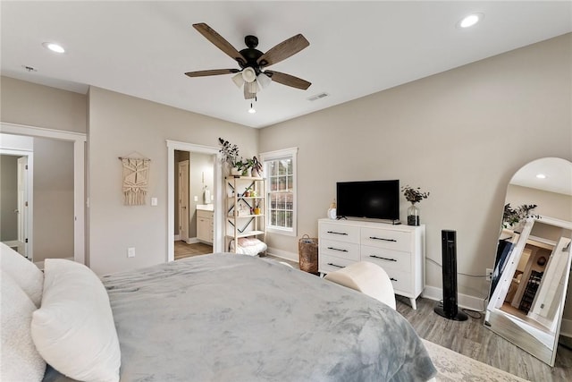 103 W Chestnut Cir, Central, SC 29630 - bedroom with wood finished floors, recessed lighting, ceiling fan, ensuite bathroom, and arched walkways
