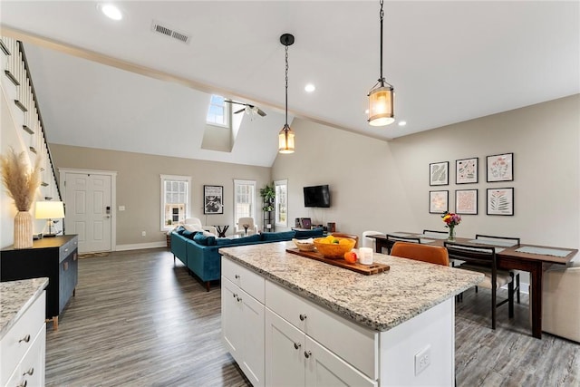 103 W Chestnut Cir, Central, SC 29630 - kitchen featuring wood finished floors, recessed lighting, a kitchen island, white cabinetry, and decorative light fixtures
