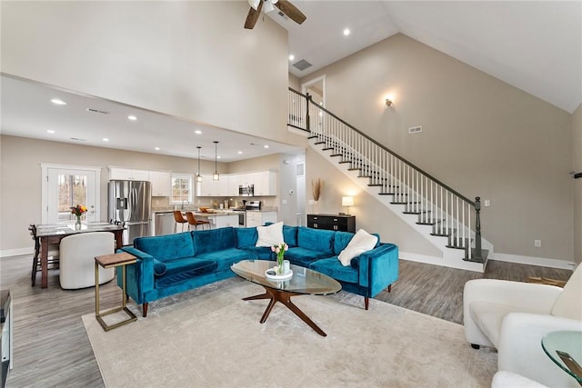 103 W Chestnut Cir, Central, SC 29630 - living area featuring wood finished floors, stairs, ceiling fan, high vaulted ceiling, and recessed lighting